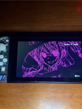 Nintendo Switch with Clear Shell and Pink Screen Artwork